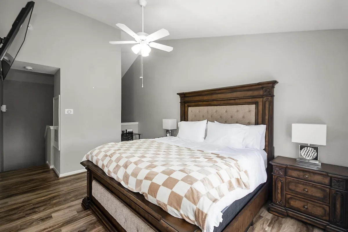 Bright two-story Houston condo living space with a sofa and dining area